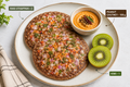 Ragi uthappam with peanut chutney and kiwi
