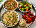 Little millet rice bowl with horse gramdal gravy, broccoli bell pepper fry-, beetroot carrot salad, lotus seed ladoo-1