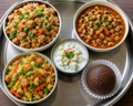 Soya brown rice bowl, black eyed pea curry ,soya bean & cabbage stir fry with cucumber raita and ragi ladoo-1