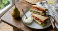 Chicken sandwich, dip, pear