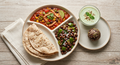Multigrain phulkas, Mexican chicken salsa gravy curry - Black chana & capsicum fry - Pudina Raita - Mixes Seed protein ladoo