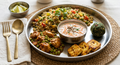 Quinoa pulav, chicken green peas gravy curry, paneer fry, carrot raita, Moringa ladoo