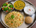 Brown rice soya pulav, broccoli salad, moongdal amaranth curry,raitha, till seed ladoo